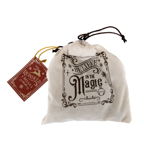 Soft drawstring bag with festive "Believe in the Magic" lettering, containing handcrafted Santa’s reindeer ornament bells, ideal for Home & Decor, Holiday Decor, Best Sellers, and Sale collections.