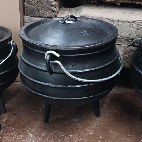 Handcrafted cast iron campfire kettle with round ribbed body, fitted lid, wire bail handle, and three legs, designed for durable outdoor cooking in Farm, Garden & Tool, Camping, Best Sellers, and Promo Eligible collections.