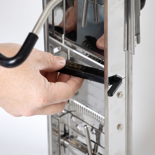 Close-up of hands adjusting the interchangeable blade mechanism on a stainless steel Lehman's Kitchen Mandoline Veggie Slicer, featured in Kitchen & Food and Food Prep collections.