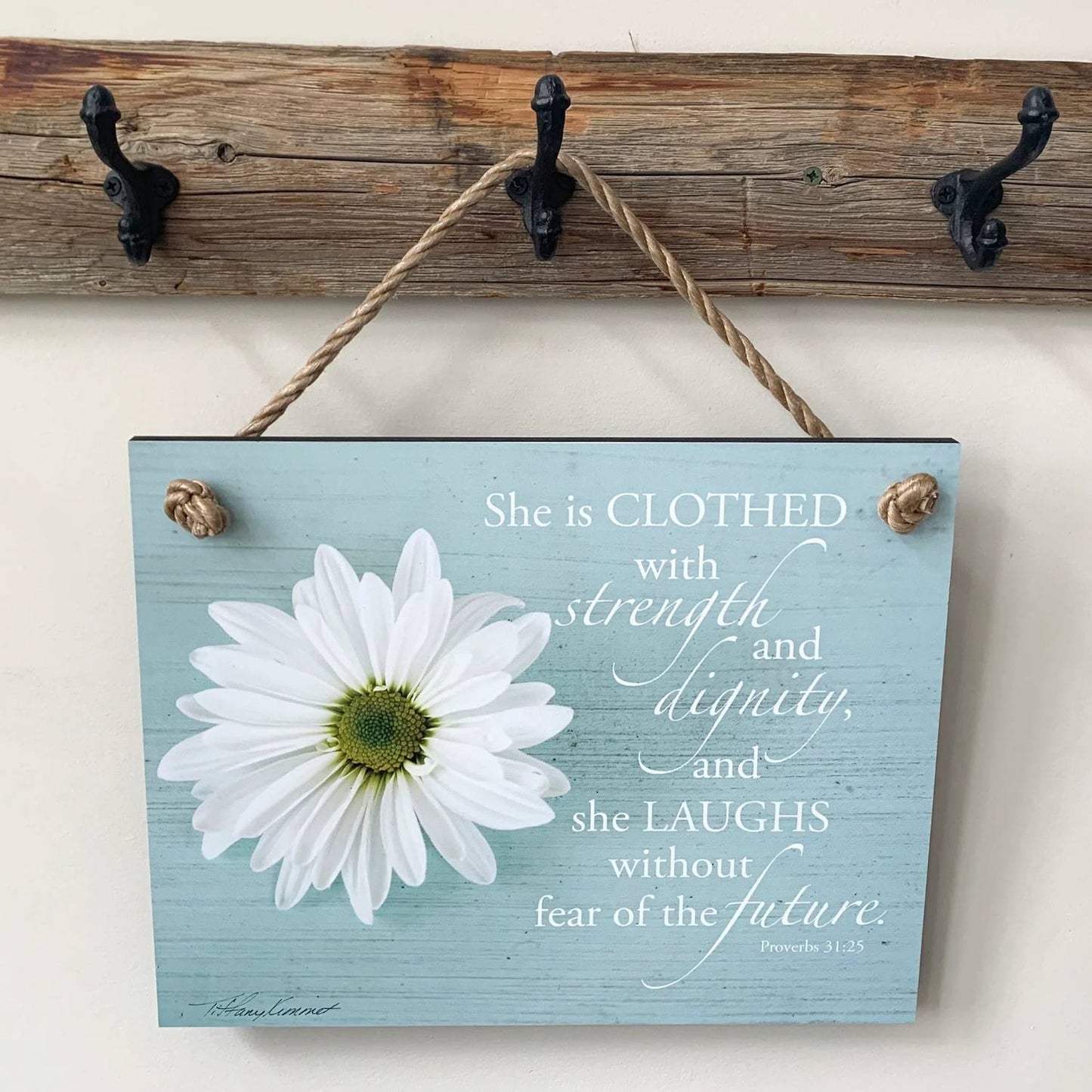 Rustic blue wooden plaque with rope hanger featuring a white daisy and an uplifting Bible verse in elegant script, perfect for Home & Decor, USA Made, and Best Sellers collections.