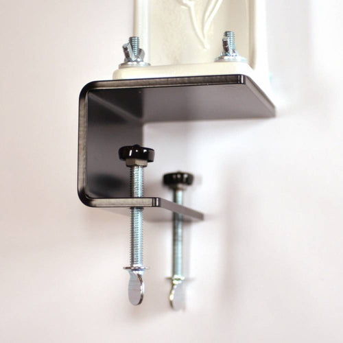 Close-up of a handcrafted sturdy steel clamp with adjustable screws, designed to securely mount a grain mill to countertops, featured in Kitchen & Food and USA Made collections.