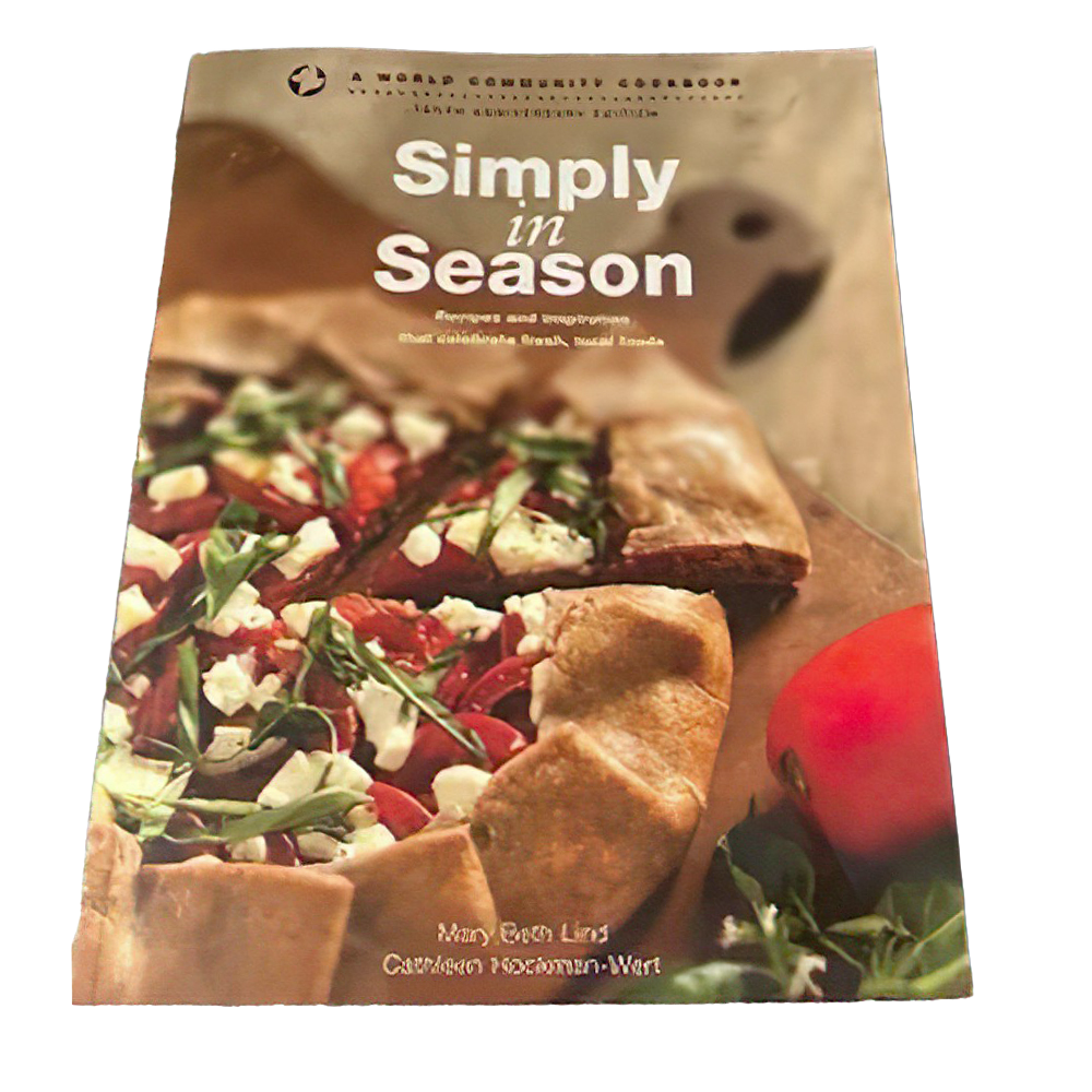 Cookbook cover featuring a rustic vegetable galette with fresh greens and cheese on parchment paper, highlighting a promotion for Simply in Season Expanded Edition in Cookbooks and Books collections.
