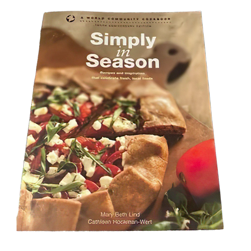 Cookbook cover featuring a rustic vegetable galette with fresh greens and cheese on parchment paper, highlighting a promotion for Simply in Season Expanded Edition in Cookbooks and Books collections.
