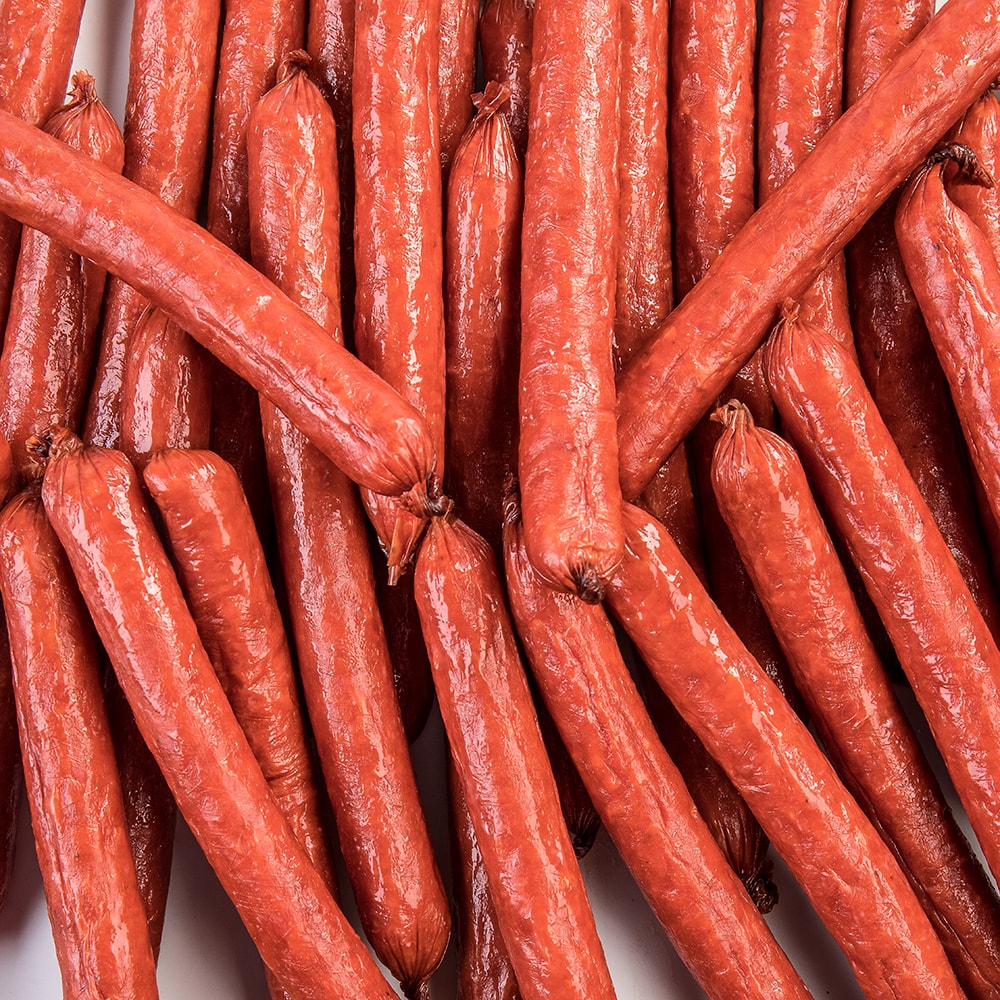 Close-up of handcrafted hickory smoked snack sticks made in USA from pork and beef, a savory protein snack ideal for Kitchen & Food, Snacks and Sweets, Meats, USA Made, Best Sellers, and Promo Eligible collections.