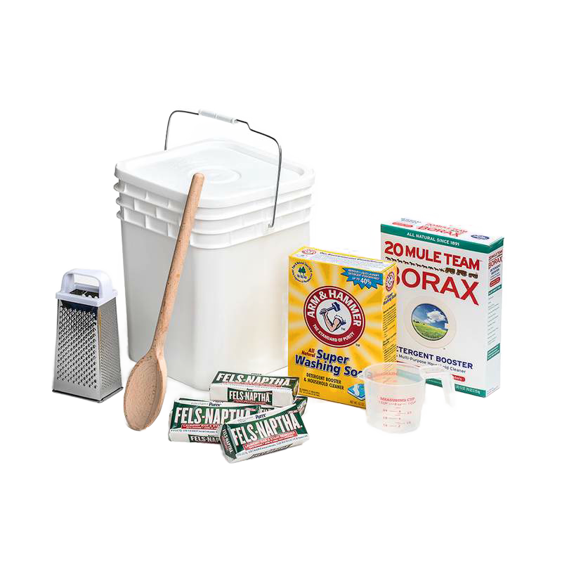 Plastic bucket with lid and metal handle alongside wooden spoon, metal grater, measuring cup, bar soaps, washing soda, and borax for making homemade laundry soap, handcrafted in the USA, suited for home and homesteading uses.