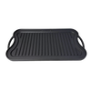 Two-sided nitrogen hardened cast iron griddle with flat and ribbed surfaces, featuring ergonomic handles, handcrafted for durable grilling in Kitchen & Food and Cookware collections.
