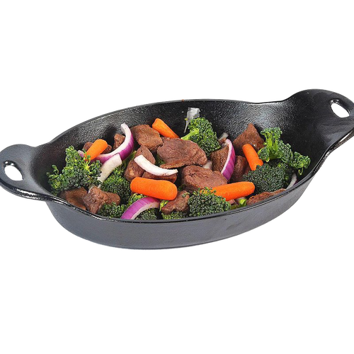 Cast iron oval mini server filled with cooked beef, broccoli florets, baby carrots, and sliced red onions, ideal for Kitchen & Food, Cast Iron, Cookware, and USA Made collections.