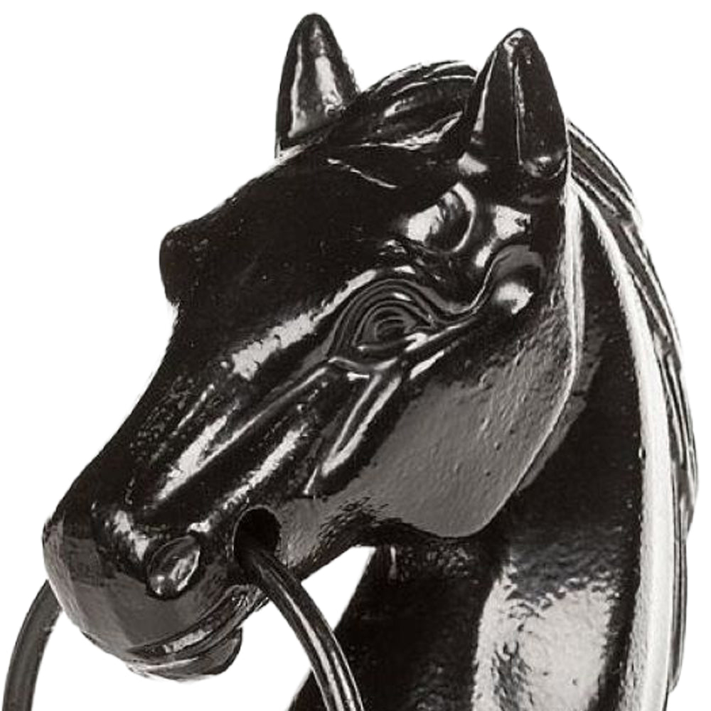 Glossy black cast iron horse head sculpture with detailed facial features and a sturdy steel ring in its mouth, ideal for adding rustic charm to home and garden decor.