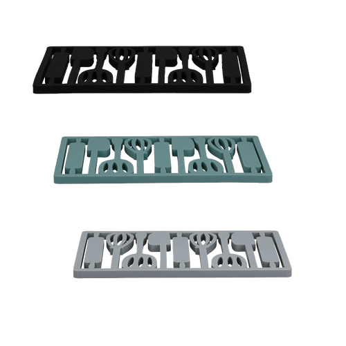 Three rectangular silicone trivets in black, teal, and light gray featuring a utensil pattern, designed for protecting surfaces during holiday hosting and kitchen use.