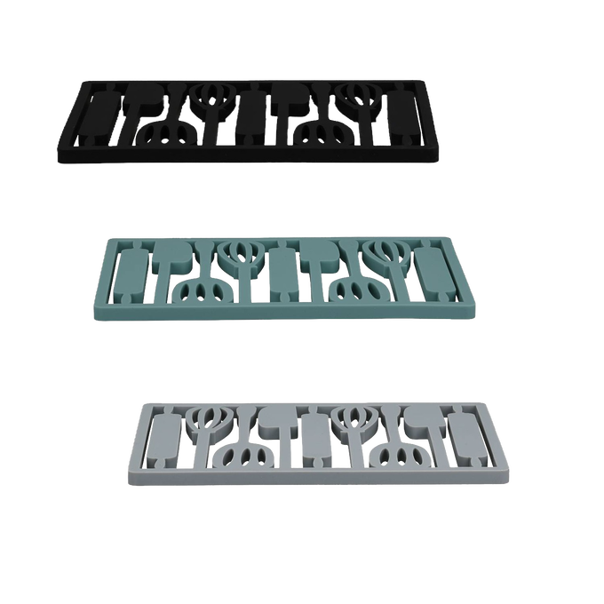Three rectangular silicone trivets in black, teal, and light gray featuring a utensil pattern, designed for protecting surfaces during holiday hosting and kitchen use.