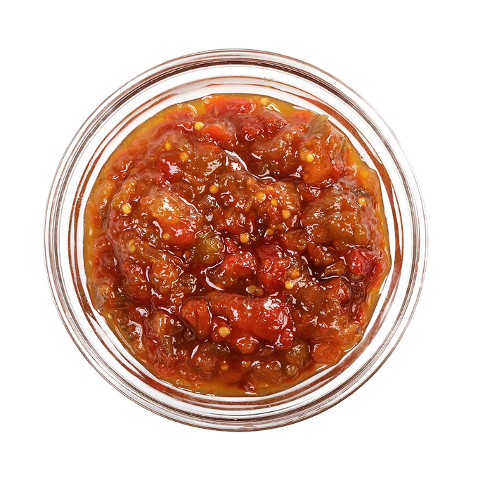 Top-down view of a jar filled with chunky red sweet pepper relish featuring visible seeds and pieces, handcrafted in USA and ideal for enhancing sandwiches and appetizers, featured in Kitchen & Food, Snacks and Sweets, Pantry, USA Made, Best Sellers, and Promo Eligible collections.
