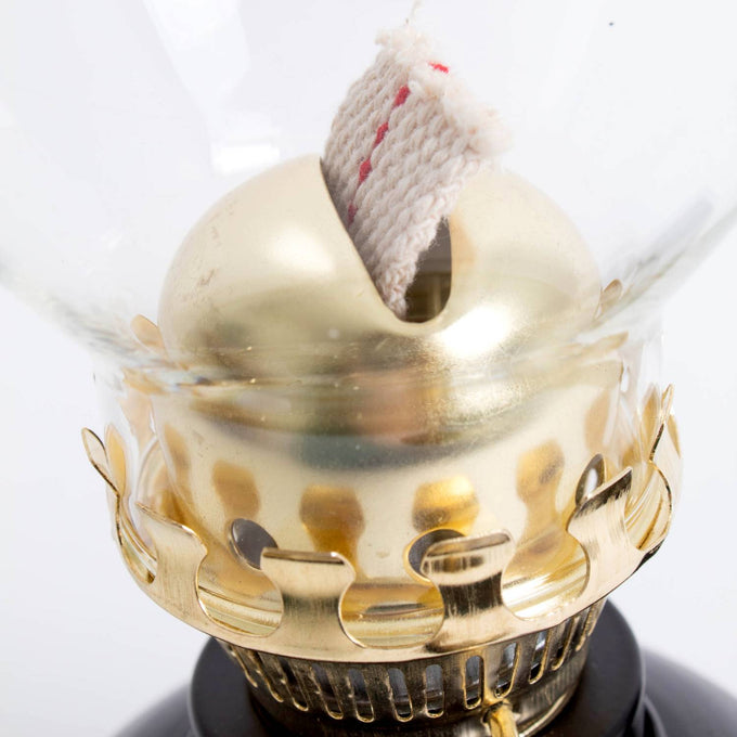Close-up of a handcrafted brass burner with wick and clear glass chimney on a vintage-style lamp, featured in Farm, Garden & Tool, Emergency Supplies, Best Sellers, and Promo Eligible collections.