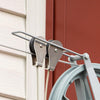 Close-up of a handcrafted metal docking bracket and pulleys securing a clothesline wire, part of a USA made laundry accessory from Home & Decor and Clothesline collections.