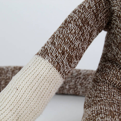Close-up of a handcrafted arm of a brown and cream knit sock monkey made in USA, featured in Toys, Books & Games, Children's Toys, Indoor Play, and Best Sellers collections.