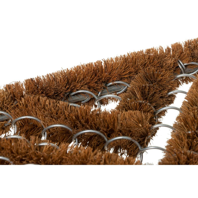 Close-up of a durable all-weather doormat with stiff coconut fiber bristles woven through wire rings, designed for porches and entryways in farm, garden, and outdoor accessory collections.
