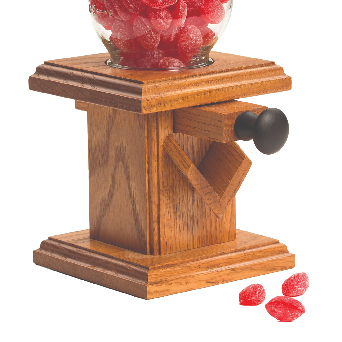 Handcrafted Amish-made stained oak candy dispenser with a glass jar filled with red candies, ideal for Kitchen & Food, Snacks and Sweets, Holiday Hosting, Storage and Serving, and USA Made collections.