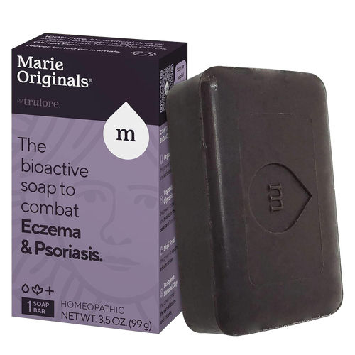 Handcrafted dark brown soap bar embossed with a stylized droplet and letter M, shown next to purple and black packaging highlighting bioactive eczema and psoriasis relief, part of Health & Wellness and Soaps collections.