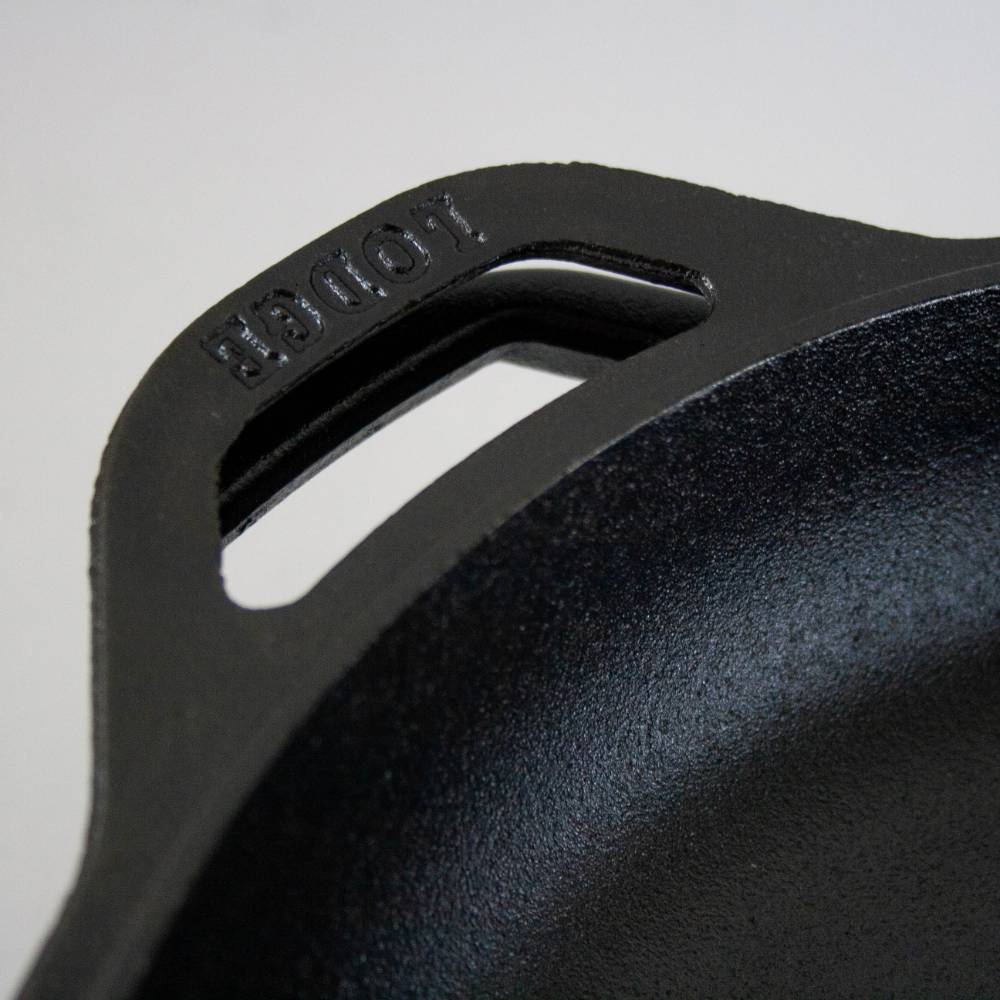 Close-up of the handle on a handcrafted black cast iron double Dutch oven, made in USA, featured in Kitchen & Food, Cookware, Cast Iron, USA Made, and Best Sellers collections.