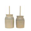 Pair of handcrafted stoneware butter churns in natural stone color with traditional double blue stripes and smooth unfinished wooden dashers, made in USA, featured in Kitchen & Food, Specialty Equipment, Making Butter, USA Made, Best Sellers, and Promo Eligible collections.