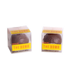 Two handcrafted chocolate hot cocoa spheres in clear boxes with bright yellow "THE BOMB" labels, made in USA, ideal for Kitchen & Food, Snacks and Sweets, Beverages, USA Made, Best Sellers, and Promo Eligible collections.