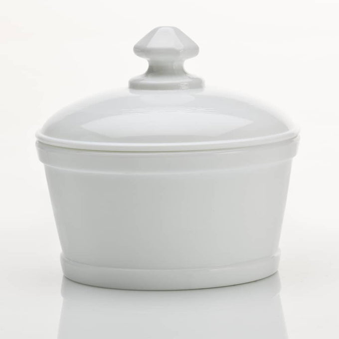 Milk-colored glass butter tub with matching lid, handcrafted by a family-owned company in Ohio, ideal for kitchen storage and serving, part of USA Made and Dinnerware collections.