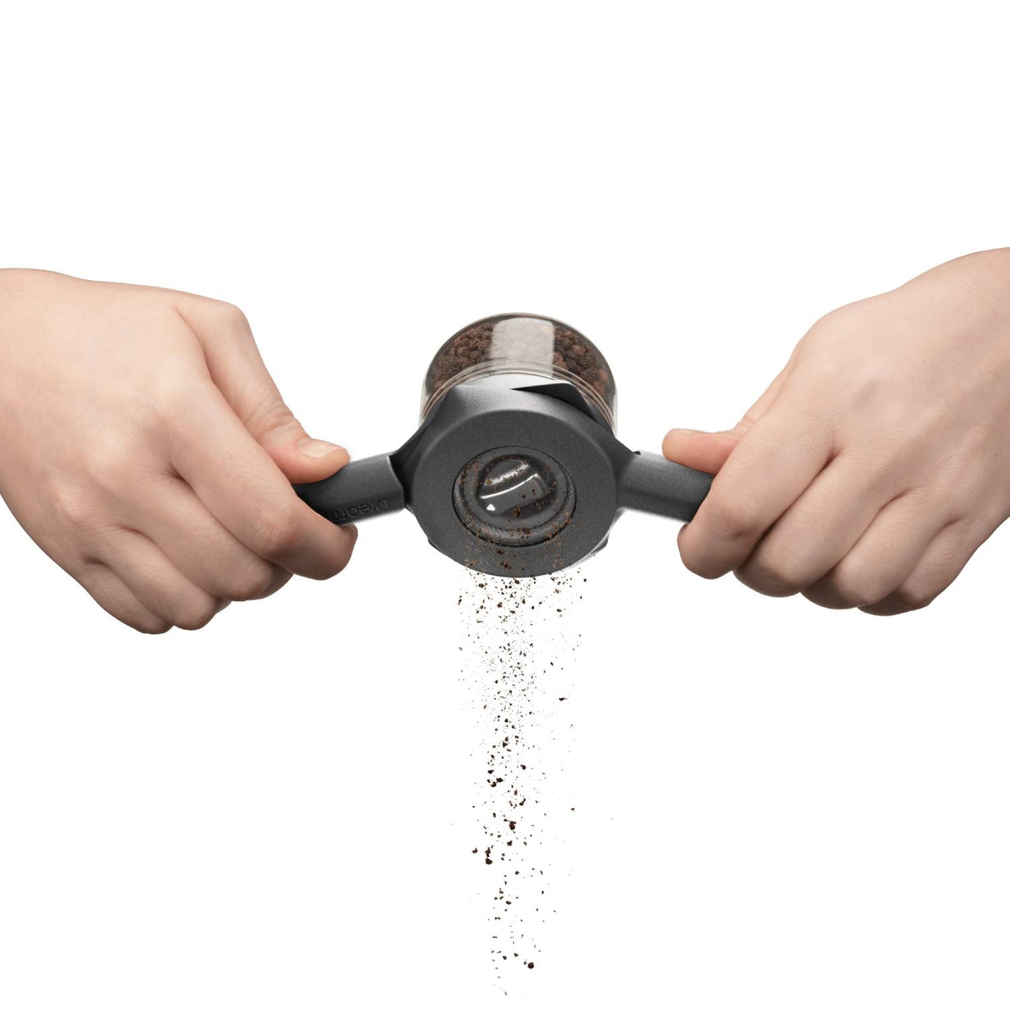 Hands operating a black and clear spice mill with ergonomic handles to grind fresh peppercorns, designed for Kitchen & Food, Dinnerware, Kitchen Gadgets, and Best Sellers collections.