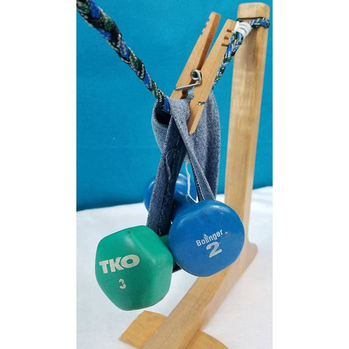 Handcrafted maple spring clothespin with stainless steel spring holding workout gloves and dumbbells on a rope, ideal for Home & Decor, Laundry Supplies, and USA Made collections.