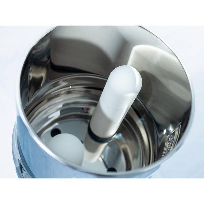Close-up of a handcrafted stainless steel gravity water filter interior showing ceramic filtering elements designed for efficient water purification in camping and emergency supplies collections.