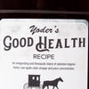 Close-up of a handcrafted health tonic label featuring a blend of organic herbs, raw apple cider vinegar, and juice concentrates, made in USA and part of Health & Wellness collections.