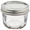 Clear glass half-pint canning jar with a wide mouth and silver lid, handcrafted in the USA, ideal for food preservation, crafts, and gift making in Kitchen & Food and Canning collections.