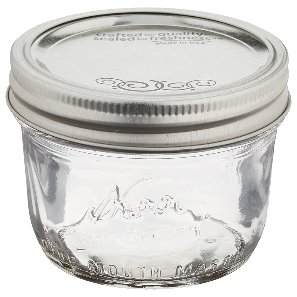 Clear glass half-pint canning jar with a wide mouth and silver lid, handcrafted in the USA, ideal for food preservation, crafts, and gift making in Kitchen & Food and Canning collections.