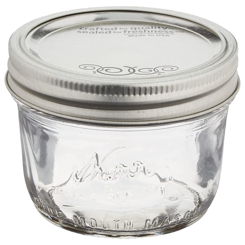 Clear glass half-pint canning jar with a wide mouth and silver lid, handcrafted in the USA, ideal for food preservation, crafts, and gift making in Kitchen & Food and Canning collections.
