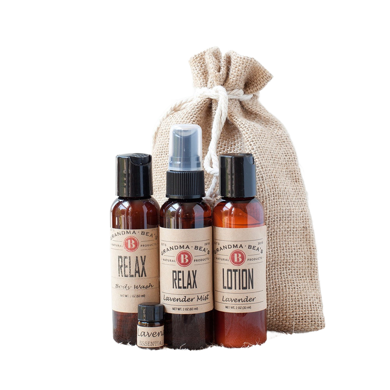 Handcrafted relaxation set featuring lavender lotion, body wash, mist spray, and essential oil in amber bottles with vintage labels, packaged in a rustic drawstring burlap bag, ideal for Health & Wellness, Grooming, Soaps, USA Made, and Best Sellers collections.