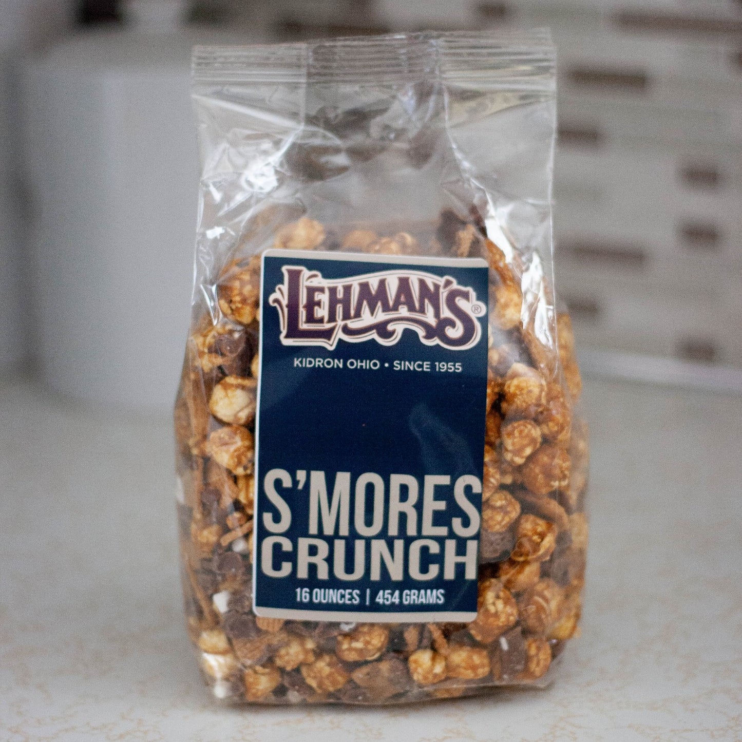 Clear bag of handcrafted s'mores flavored caramel popcorn with crunchy texture, a unique sweet and crunchy snack made in USA, ideal for Kitchen & Food, Snacks and Sweets, Popcorn, USA Made, Best Sellers, and Promo Eligible collections.