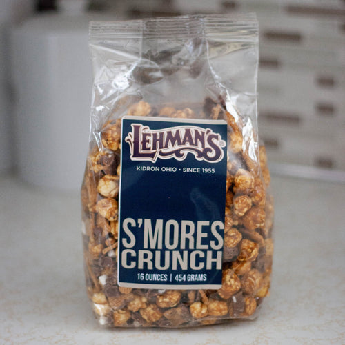 Clear bag of handcrafted s'mores flavored caramel popcorn with crunchy texture, a unique sweet and crunchy snack made in USA, ideal for Kitchen & Food, Snacks and Sweets, Popcorn, USA Made, Best Sellers, and Promo Eligible collections.
