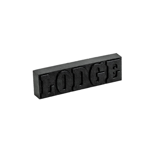 Black rust eraser bar embossed with "LODGE," designed for restoring cast iron cookware, handcrafted in USA, featured in Kitchen & Food and Household Cleaning collections.