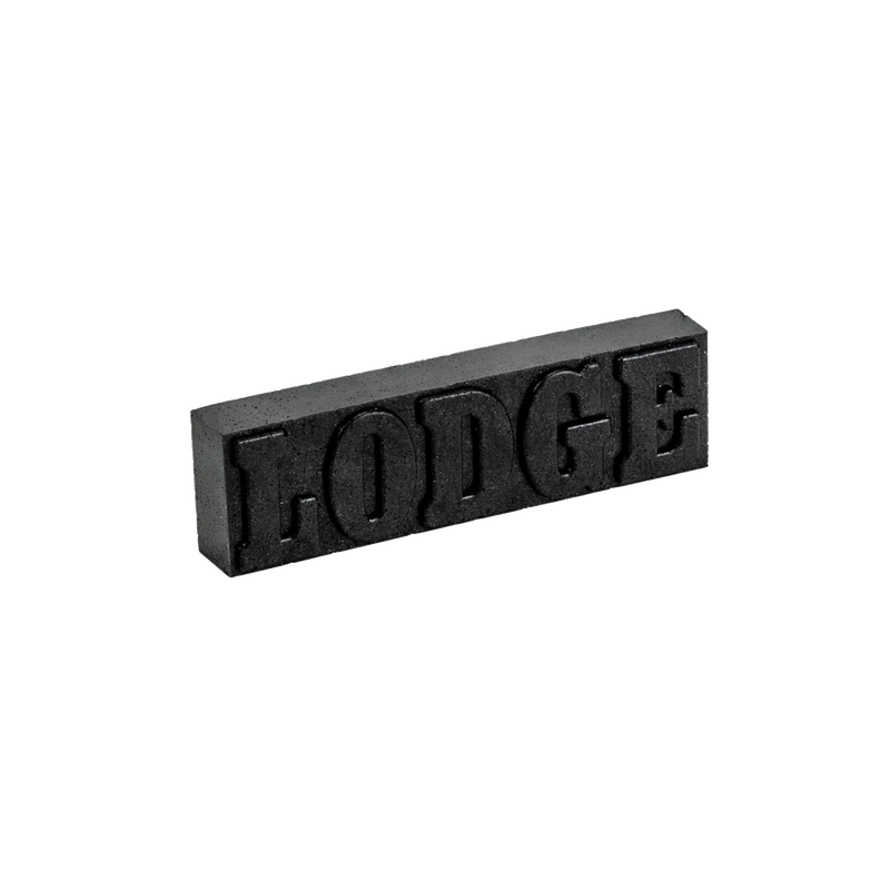 Black rust eraser bar embossed with "LODGE," designed for restoring cast iron cookware, handcrafted in USA, featured in Kitchen & Food and Household Cleaning collections.