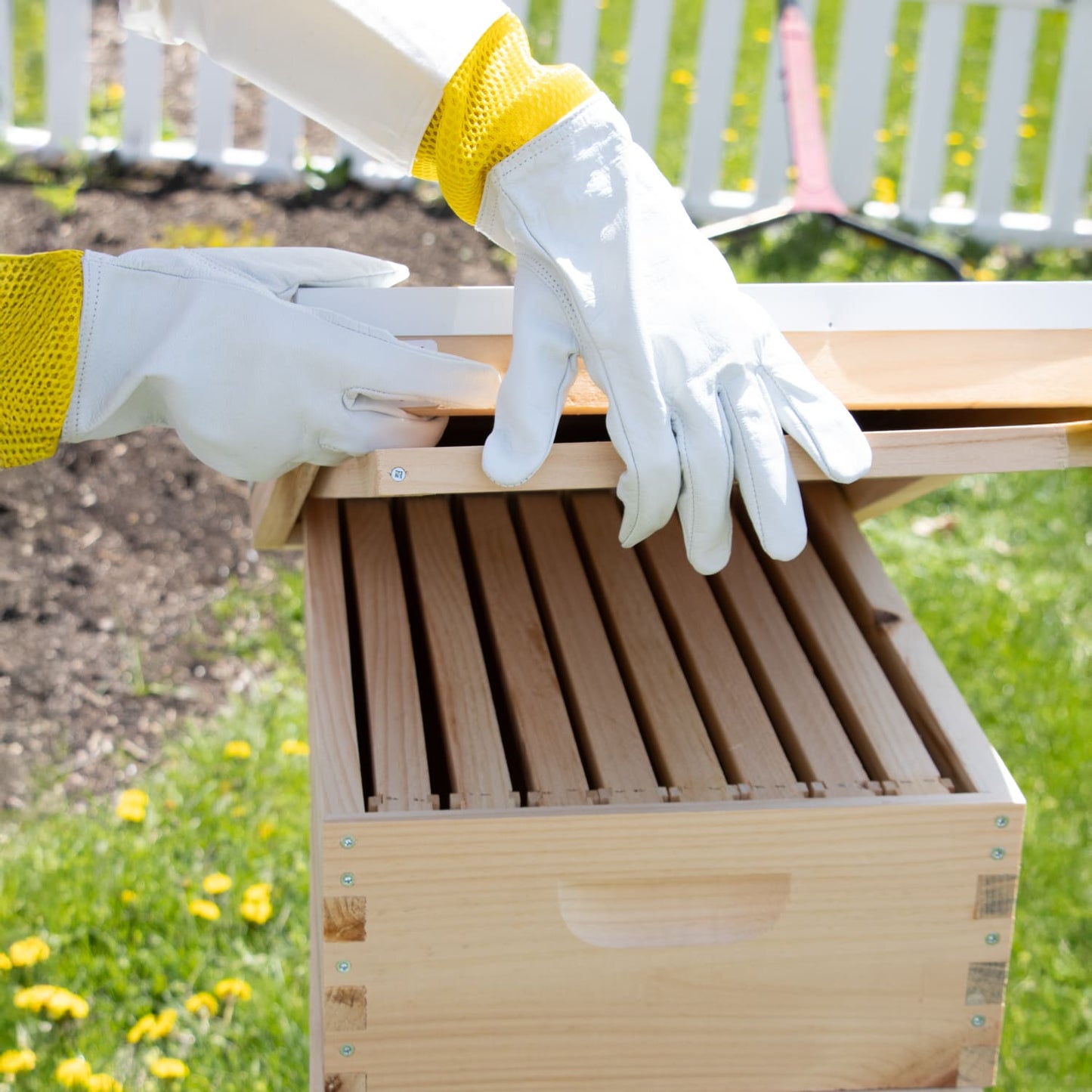 Gloves made from smooth goatskin with vented yellow elastic cuffs, providing dexterity and protection while working with bees, featured in farm and garden gear collections.