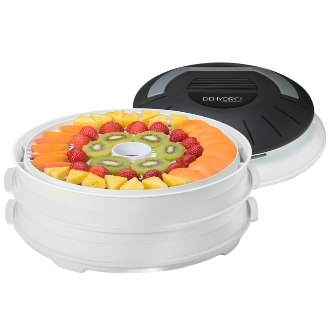 Compact electric food dehydrator with nesting white trays holding sliced strawberries, kiwi, pineapple, and apricot, ideal for Kitchen & Food and Food Preservation collections.