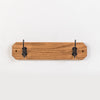 Handcrafted oak wallboard with two black metal hooks, Amish made in USA, designed for neat coat organization, featured in Home & Decor, Household Helpers, and Best Sellers collections.