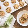 Aluminum half sheet baking pan with lid featuring freshly baked peanut butter cookies with colorful candy pieces, paired with a green-striped kitchen towel and white plate, ideal for Kitchen & Food, Cookware, and Baking Supplies collections.
