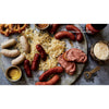 Assorted handcrafted German-style sausages, sauerkraut, mustard, pretzels, liverwurst spread, and a glass of beer with a bottle opener, featured in Toys, Books & Games, Cookbooks, and Best Sellers collections.