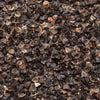Close-up of natural buckwheat hulls with a rich brown color and smooth texture, used as adjustable filling in handcrafted, USA made home textiles and bedding products.
