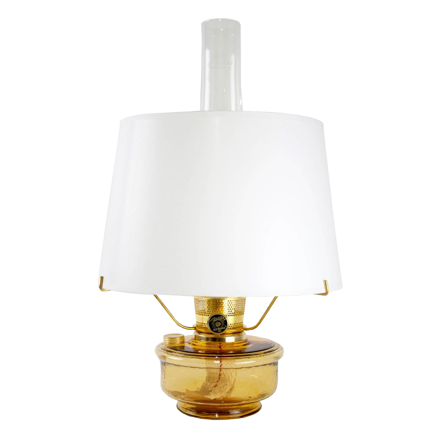 Amber glass oil lamp with a crisp white parchment shade and clear chimney, featuring a brass burner and tripod stand, bright enough for reading, ideal for Farm, Garden & Tool, Lamps & Lighting, Emergency Supplies, and Best Sellers collections.