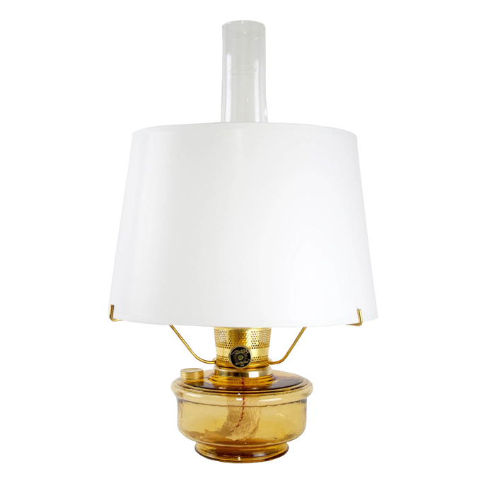 Amber glass oil lamp with a crisp white parchment shade and clear chimney, featuring a brass burner and tripod stand, bright enough for reading, ideal for Farm, Garden & Tool, Lamps & Lighting, Emergency Supplies, and Best Sellers collections.