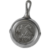 Small cast iron skillet with a raised wolf and mountain design on the bottom, made in the USA, ideal for Kitchen & Food, Cast Iron, Cookware, and Best Sellers collections.