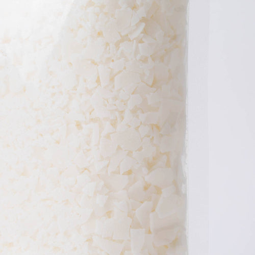 Close-up view of handcrafted all-natural soy wax pellets in a clear 1-pound bag, suitable for candle making, featured in Lamps & Lighting, Candles and Candlemaking, Candlemaking Supplies, and Best Sellers collections.