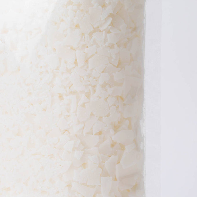 Close-up view of handcrafted all-natural soy wax pellets in a clear 1-pound bag, suitable for candle making, featured in Lamps & Lighting, Candles and Candlemaking, Candlemaking Supplies, and Best Sellers collections.