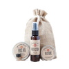 Compact wellness kit featuring natural first aid balm, protection essential oil blend, and restore healing salve in a handcrafted burlap bag, ideal for Health & Wellness collections.