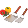 Handcrafted professional kitchen utensils with high-carbon stainless steel blades and wooden handles, displayed alongside fresh red and yellow bell peppers and parsley, ideal for Kitchen & Food, Kitchen Gadgets, Cooking and Baking Helpers, Storage and Serving, USA Made, Best Sellers, and Promo Eligible collections.